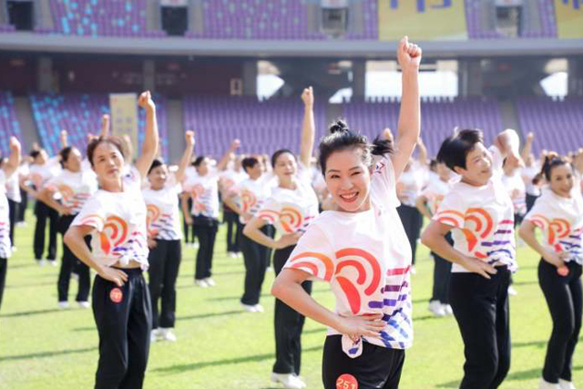 Line dancers dance to welcome Asian Games