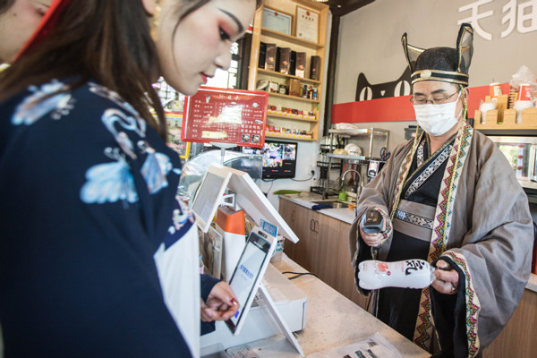 shopkeeper in Hanfu suit hangzhou.jpg