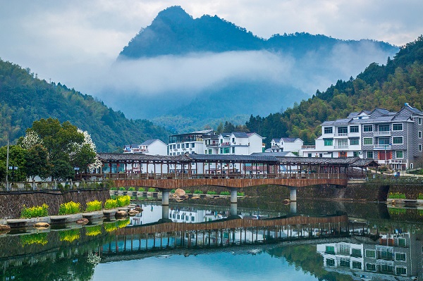 Lucid waters and lush mountains lift this village out of poverty