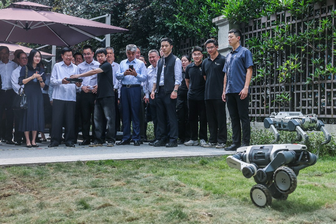 Lao president operates Chinese-made robot dog