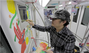 Illustrators paint subway cars in Hangzhou