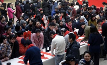 Calligraphers write Chinese character 