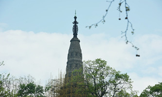 Ancient pagoda takes off 'face mask' to breathe spring air