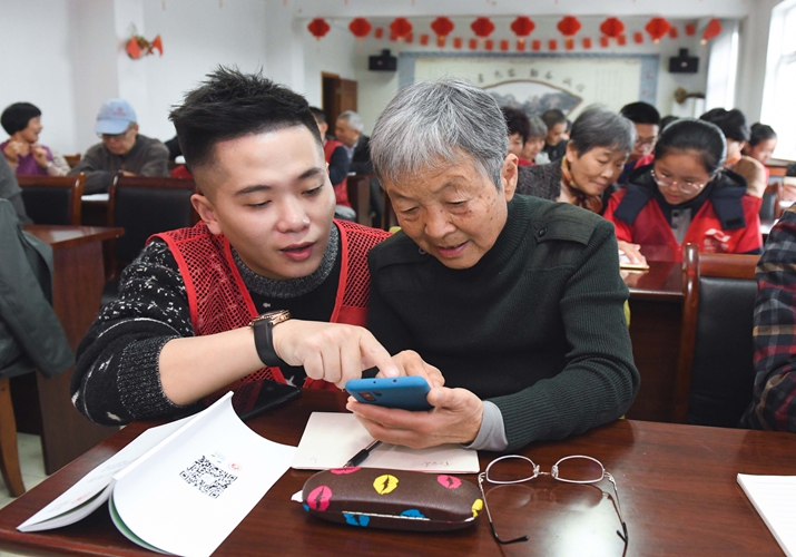 Young volunteers live with, offer support to elderly citizens under pilot 'intergenerational integration' program