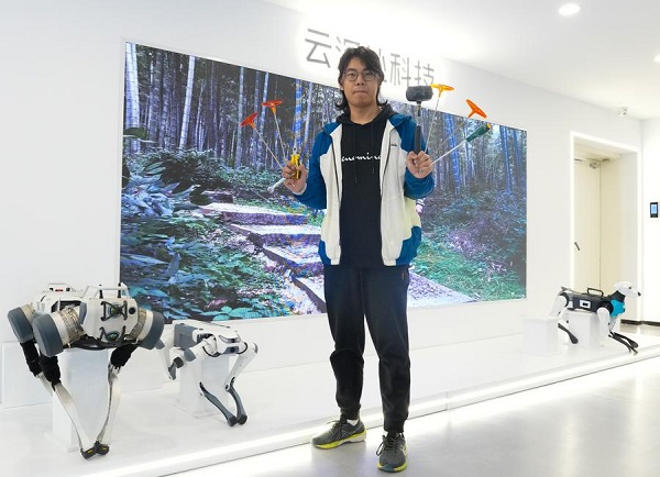 Young engineer enchanted with robotics in Hangzhou